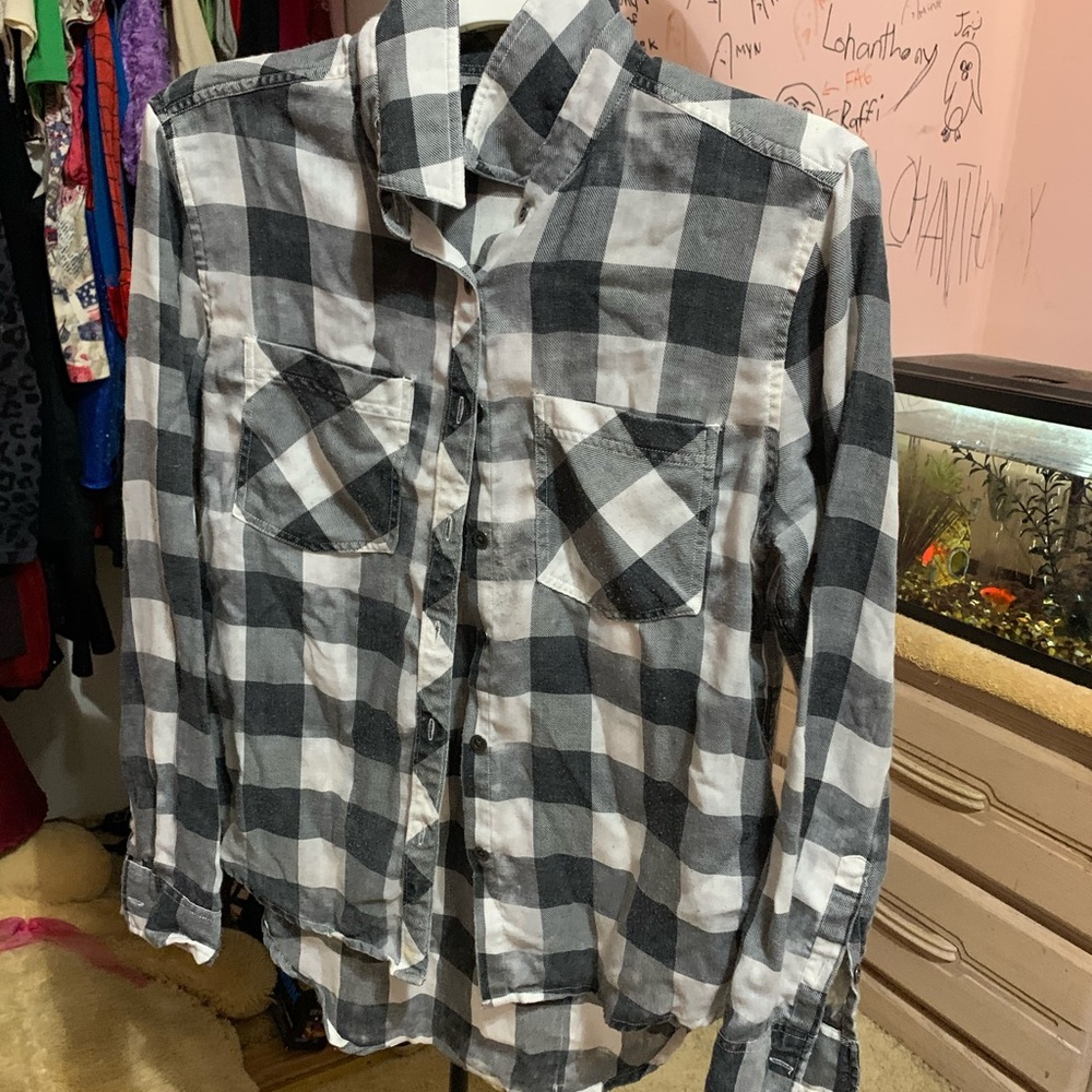 White and black flannel. Size small. Gently used.